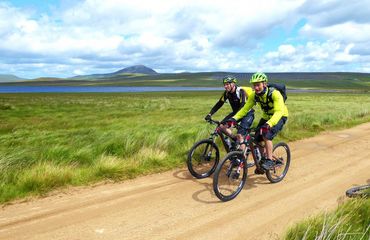 Two cyclists on sandy track