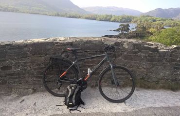 Bike by wall overlooking water