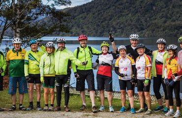 Group of cyclists by lake