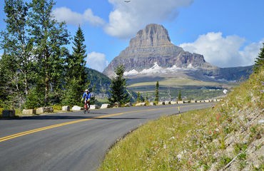 Road cycling with mountain in background