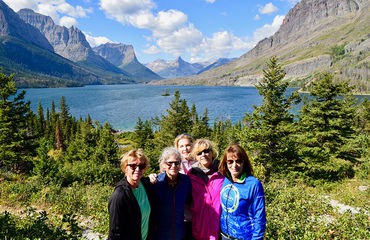 Group of women infront of lake and mountains