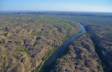 Aerial view of rugged landscape and river