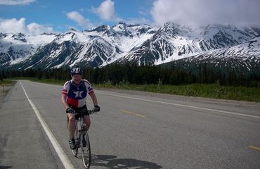 Cyclist riding alpine road