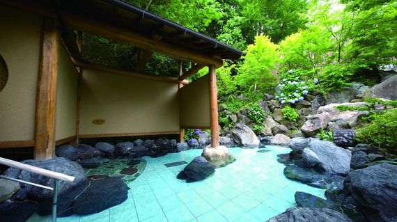 After a day of cycling, unwind at this ryokan's hot spring bath.