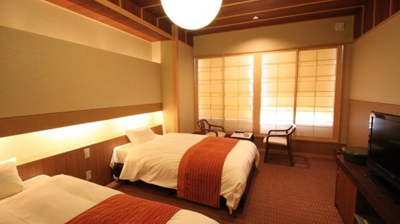 After a day of cycling, unwind at this ryokan's hot spring bath.