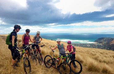Group of mountain bikers on side of hill