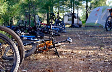 Bikes on the ground by tents