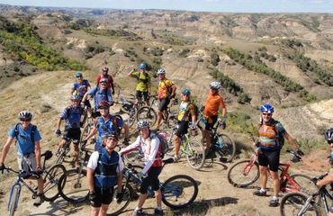 Group of cyclists on top of hill