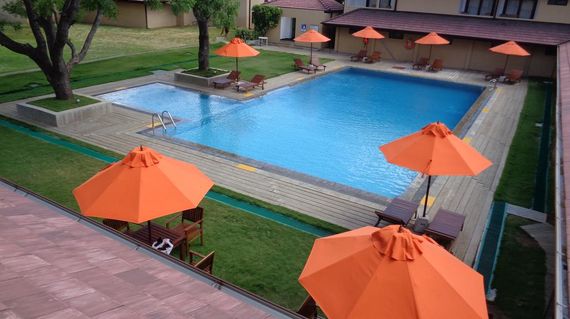 Cap of your adventure at a modern hotel with outdoor pool