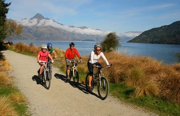 Group cycling by a lake
